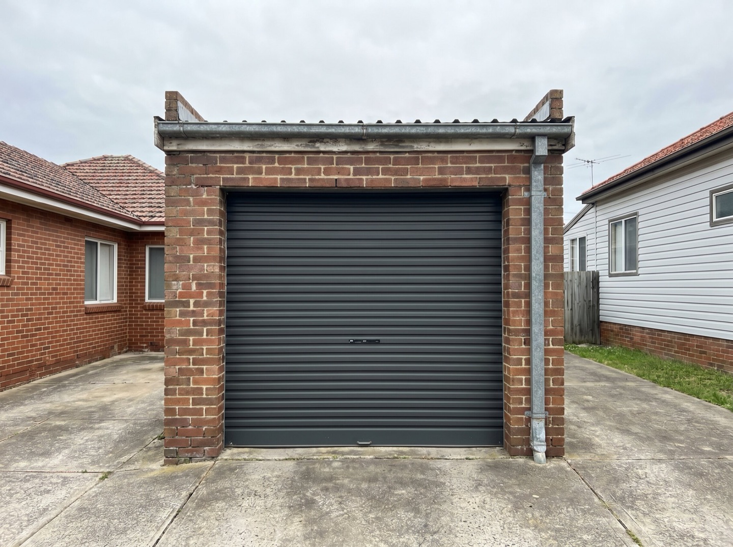 A corrugated steel roller garage door on an older Newcastle garage